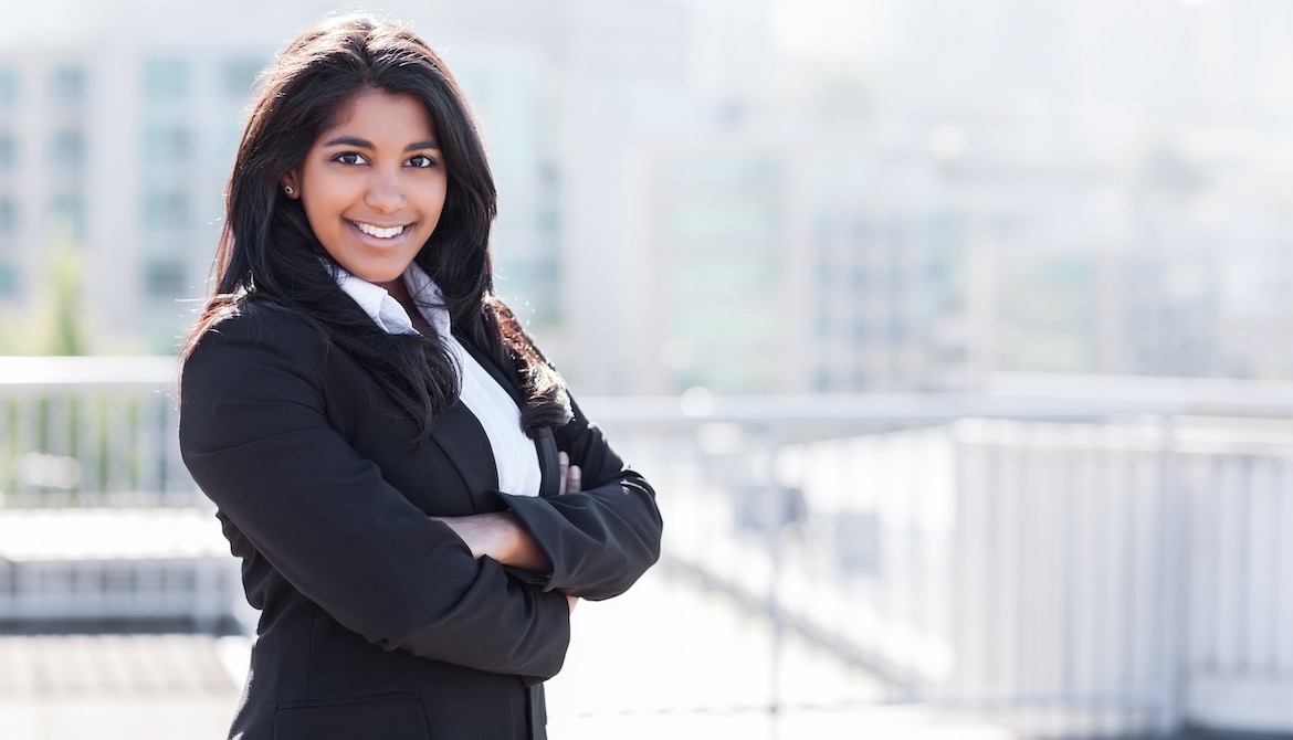 young professional woman smiling confidently at camera
