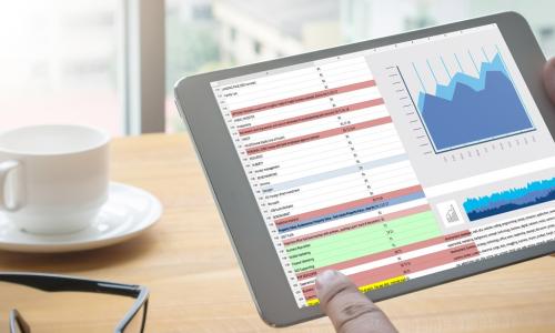 data on a tablet being considered by an executive