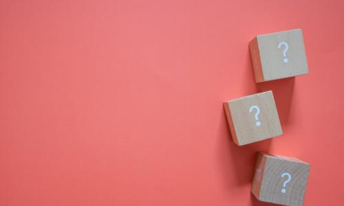 question mark blocks on salmon background