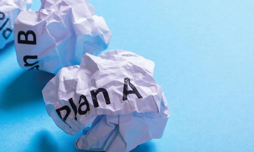crumpled balls of paper labeled plan A plan B and plan C 