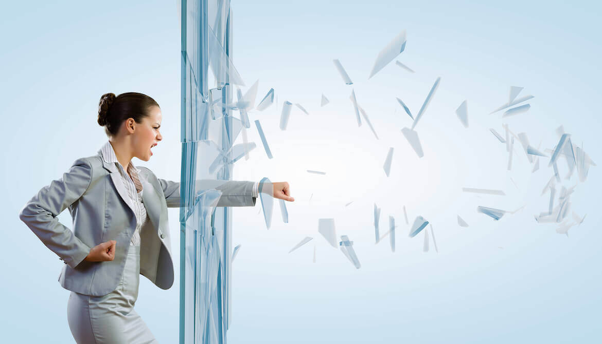 woman punching through glass window