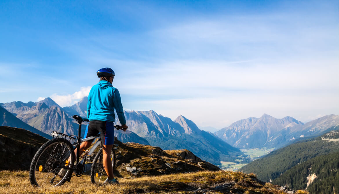 biker views a beautiful mountain vista