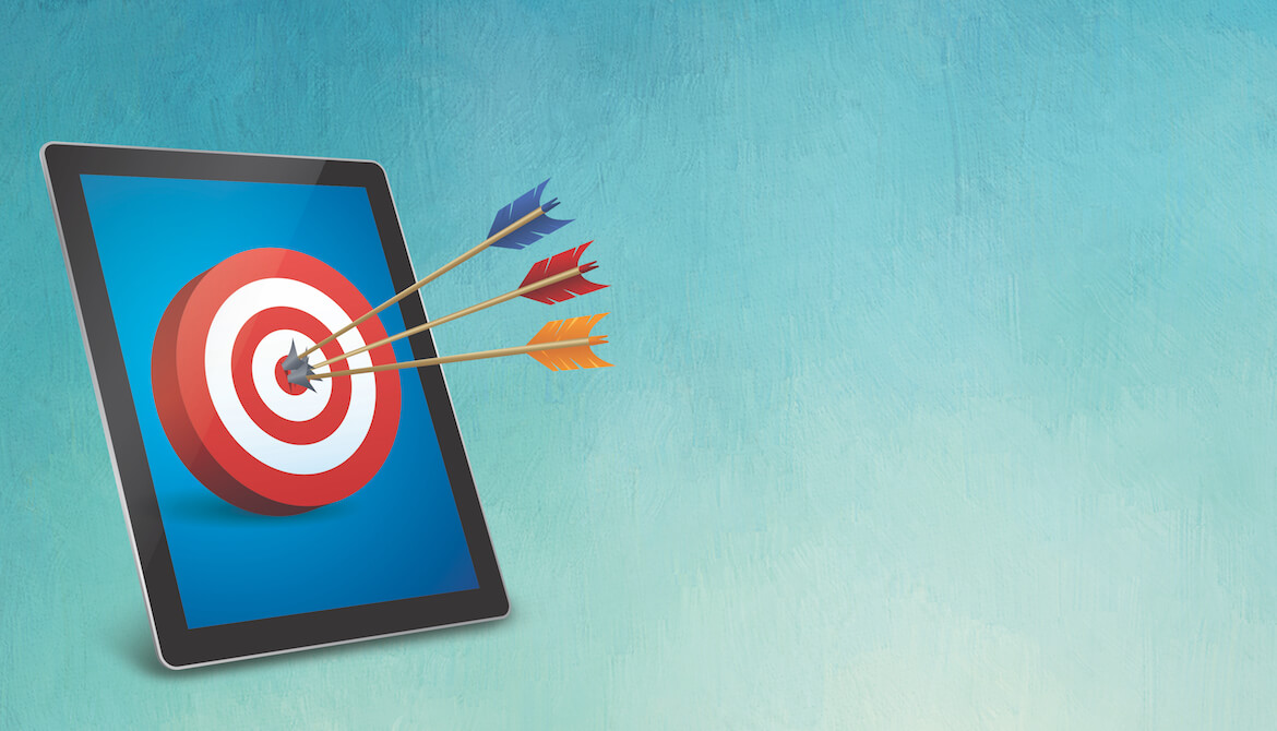 a tablet has a target with arrows in the bullseye