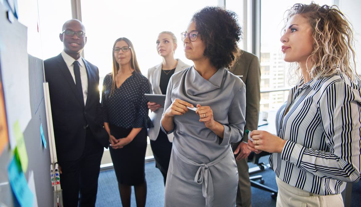 african american woman leads a business team