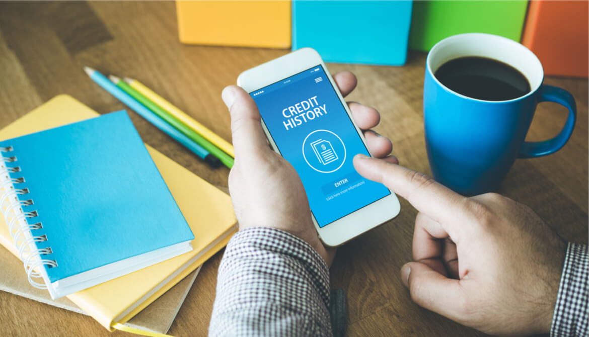 man checking his credit history on mobile device