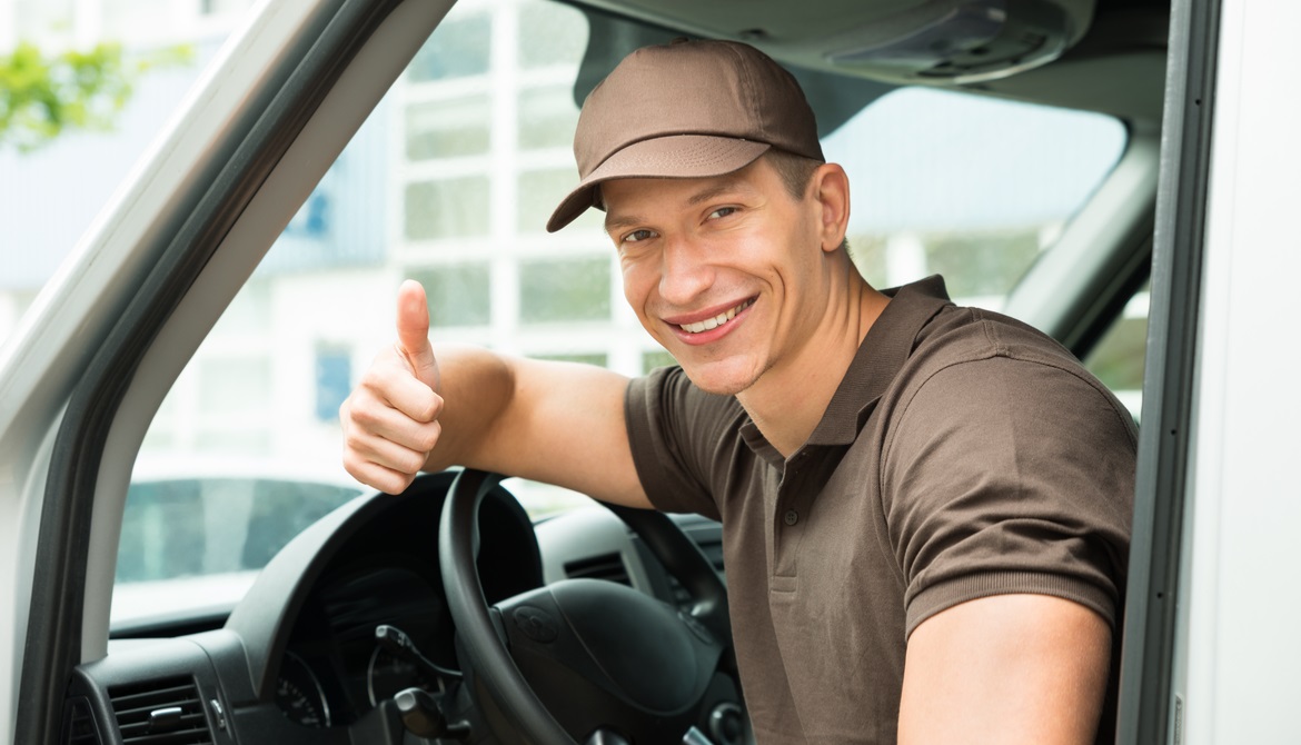 delivery man thumbs up in van