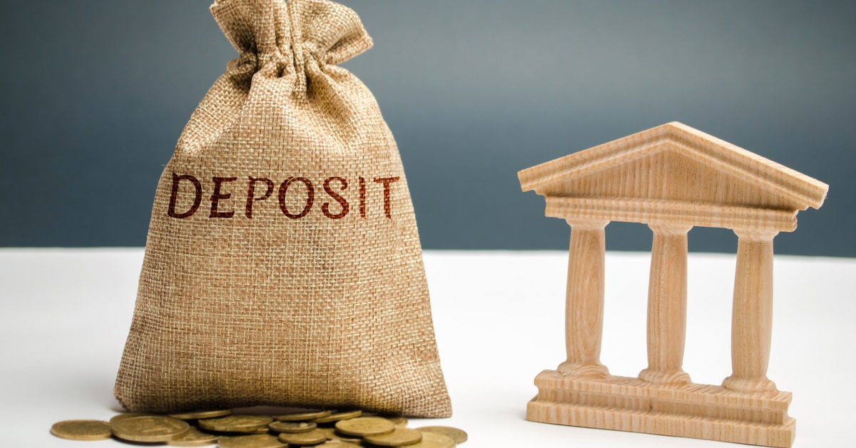 burlap bag with coins and a set of pillars