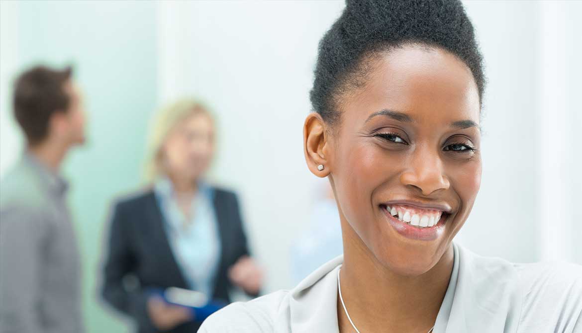 Confident young black female leader smiling