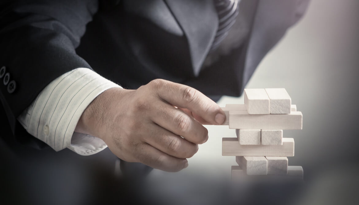 Business man decision to choosing the wood block on blurred office background