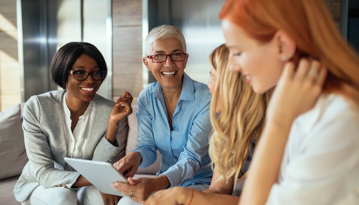 happy female executives working together