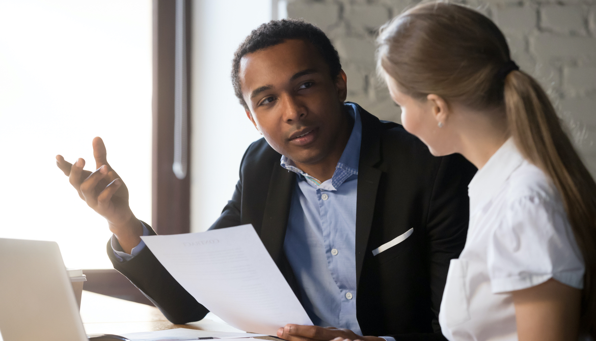 African American man and white woman in a conversation 