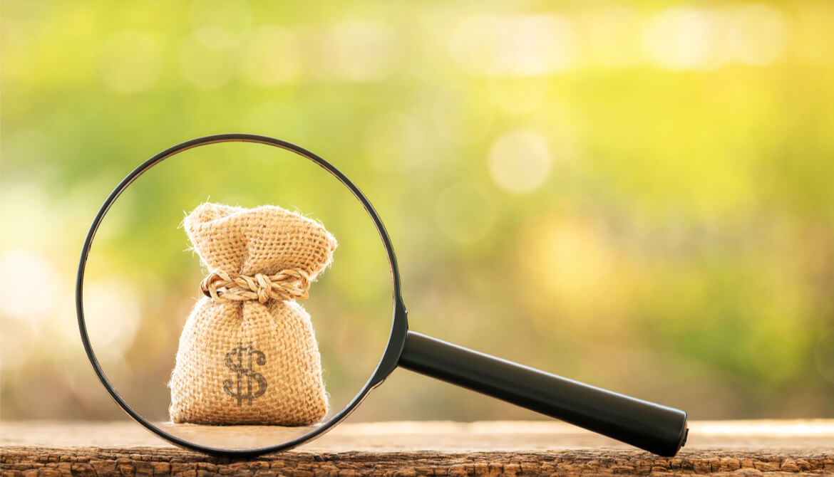 magnifying glass over burlap bag