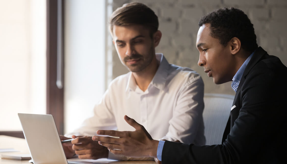 Black manager mentoring white man