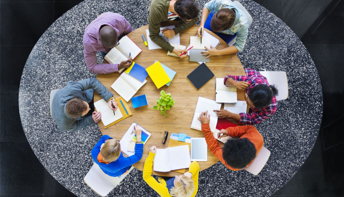 diverse people at table, planning