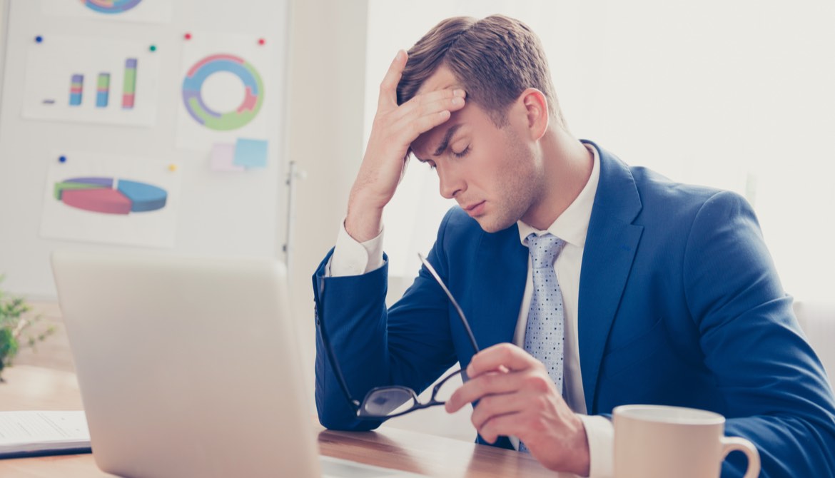 businessman burned out laptop coffee