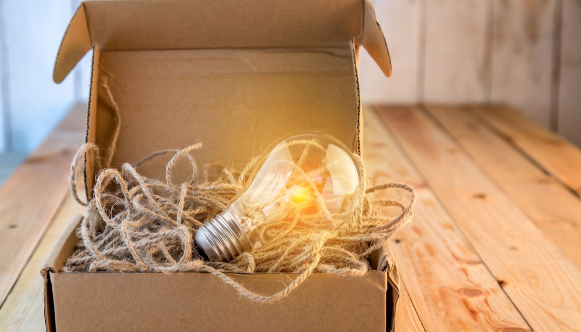 light bulb with string in a cardboard box