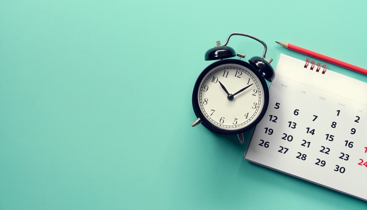 calendar and clock with pencil