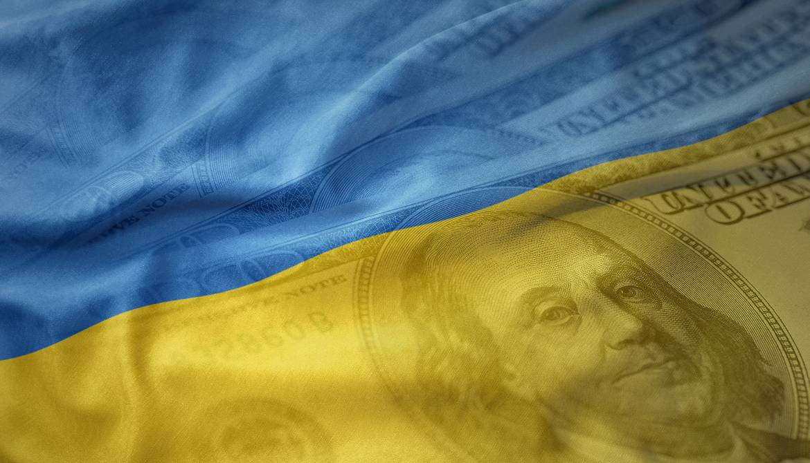 Ukraine flag flowing over US currency