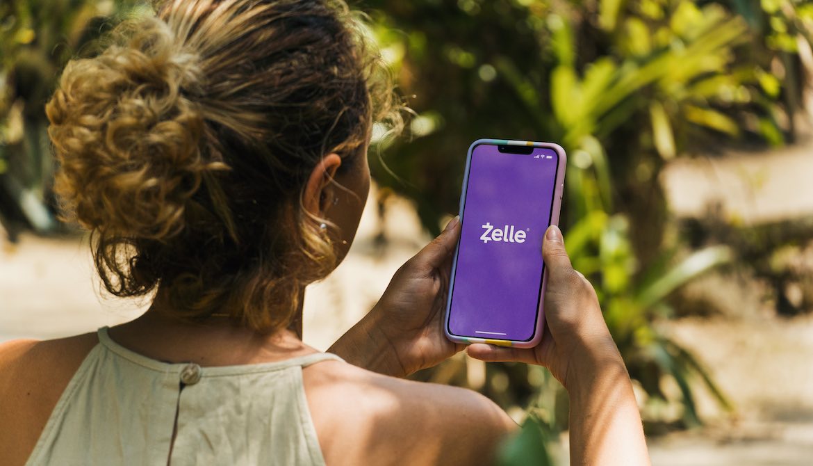 woman park smartphone Zelle