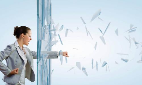 woman punching through glass window