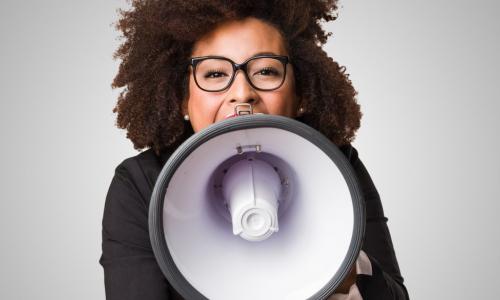 business woman using a megaphone