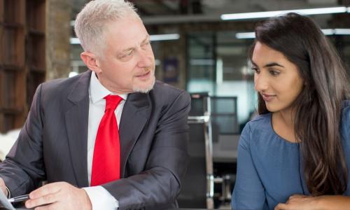 male executive serving as a mentor to a younger female executive