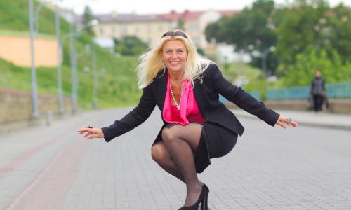 female executive on skateboard