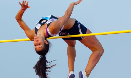 woman clears high jump