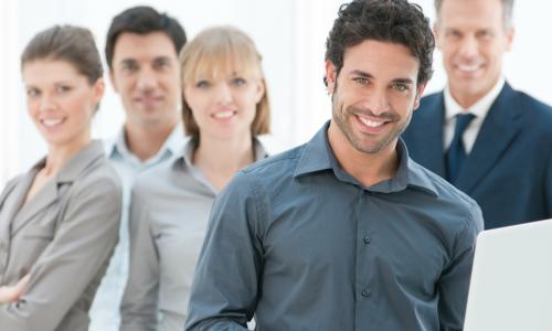 Smiling employees of various ages