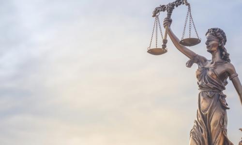 Statue of Justice holding scales and sword 