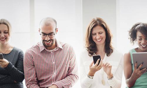 diverse group of people using different mobile devices