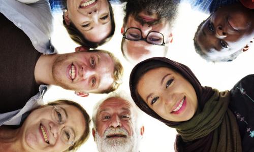 people of different ages and nationalities looking down at camera