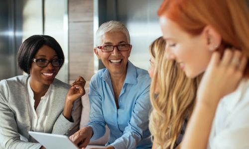 happy female executives working together