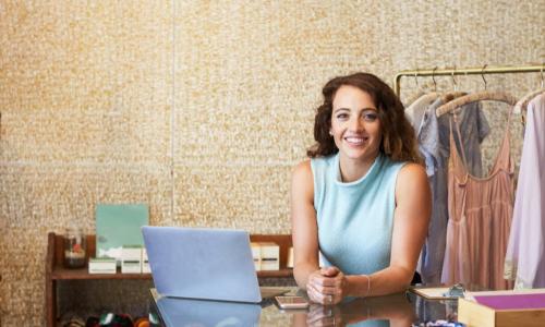 female clothing store owner at counter