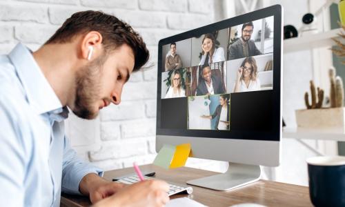 man learning with others via computer