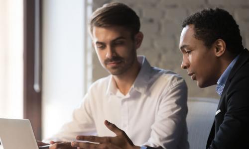 Black manager mentoring white man