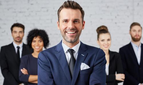 leader in front of diverse group of executives