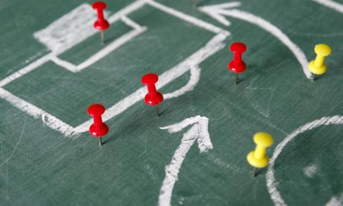 soccer game strategy diagram using chalkboard and push pins