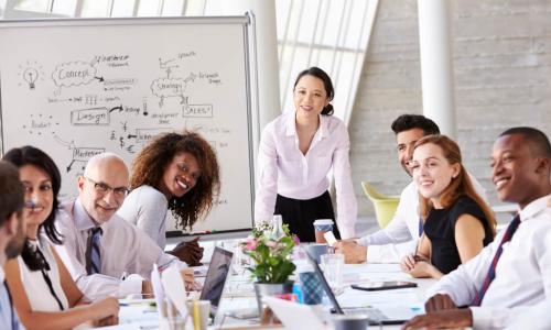 Asian businesswoman leading meeting