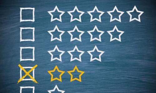 two stars drawn on chalkboard for low performance rating